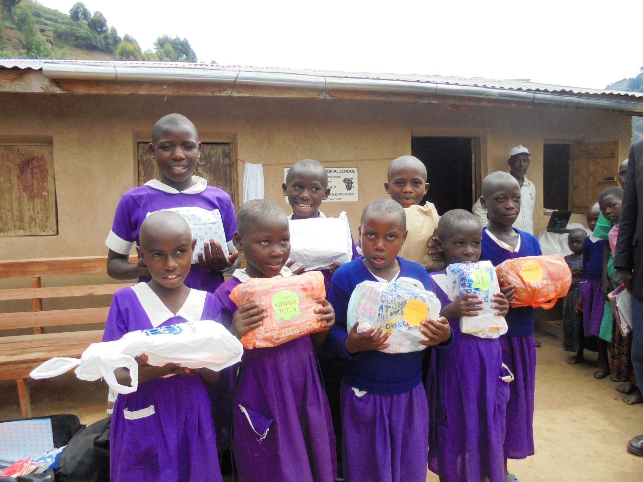 Sponsored children with packages from their UK sponsors