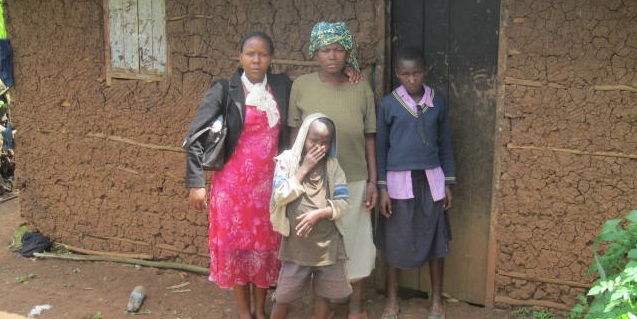 Woman and her children with our staff