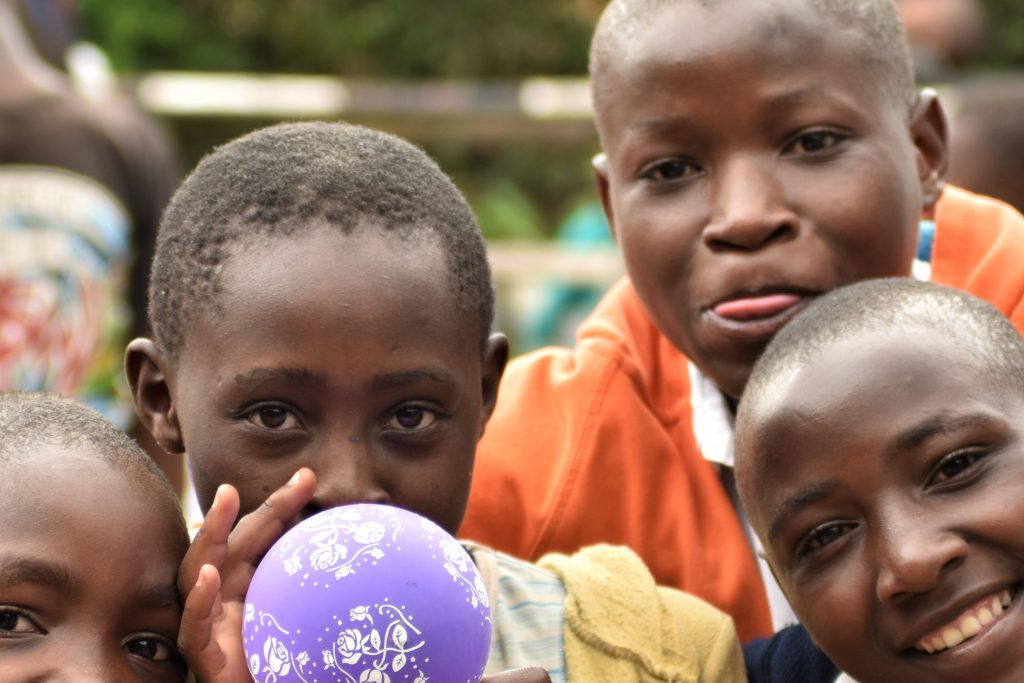 A group of boys look at the camera